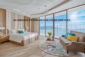 a hotel room with a bed and a couch at SeaBreeze Panorama Grand Residences in Nha Trang