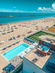 an aerial view of a beach and a swimming pool at You & Me Beach Hotel in Rimini