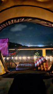 a view from the back seat of a car with a chair at SZ Samui Glamping in Ban Sa Ket