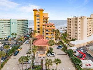an aerial view of a city with buildings and the ocean at Atlantic Villas 402 in New Smyrna Beach
