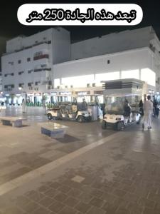 a parking lot with two carts in front of a building at شقق جادة قباء in Medina