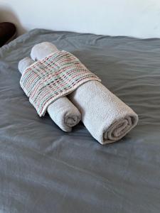 a towel is laying on top of a bed at Shard room in London