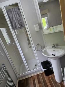 a bathroom with a shower and a sink at 53 Kingsgate Lower Hyde in Shanklin