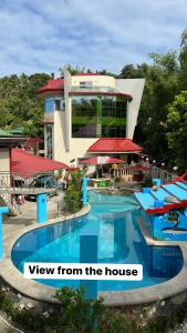 a view from the house of a resort swimming pool at Heaven’s Gate Resort in Puerto Galera