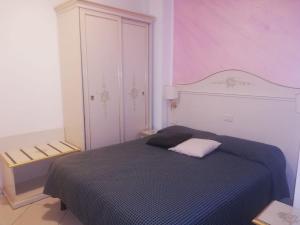 Postel nebo postele na pokoji v ubytování B&B Metropols Sottomarina