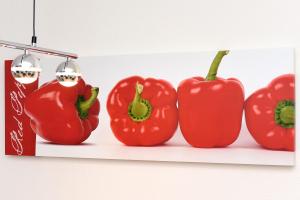 a group of red peppers hanging on a wall at Ferienhaus Antares - Uns Huus an t Küst in Bensersiel +23 photos