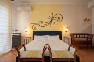 Кровать или кровати в номере Lola Piccolo Hotel e Appartamenti