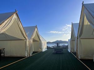 a row of tents on the deck of a ship at Lucky Tito Coron Dive Resort in Coron