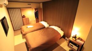 Postel nebo postele na pokoji v ubytování Resort Inn Marion Shinano