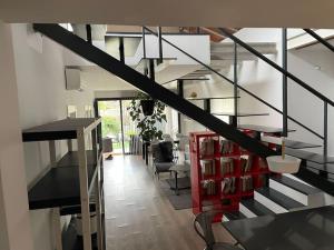 eine Treppe in einem Haus mit einem roten Schrank in der Unterkunft House in Sant Cugat, 25 Mins to Barcelona center in Sant Cugat del Vallès