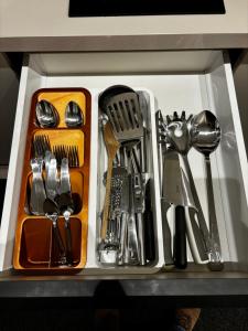 a tray of utensils in a drawer at K40 Residence, with pool on the top! in Budapest