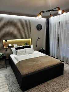 a bedroom with a large bed in a room at K40 Residence, with pool on the top! in Budapest