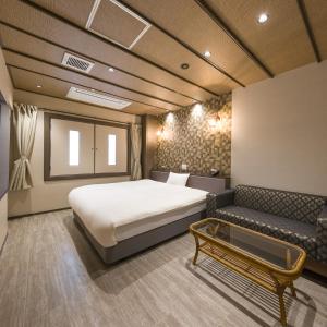 Postel nebo postele na pokoji v ubytování Hotel Noir Blanc