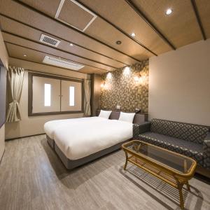 Postel nebo postele na pokoji v ubytování Hotel Noir Blanc