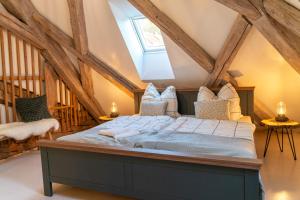 a bedroom with a bed in the attic at Ferienwohnung in der alten Brauerei in Schwäbisch Hall