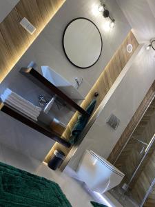 a bathroom with a sink and a mirror at Apartament Nasze Poddasze in Ciche +12 photos