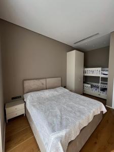 a bedroom with a large bed in a room at Sea breeze Lighthouse 2 in Baku