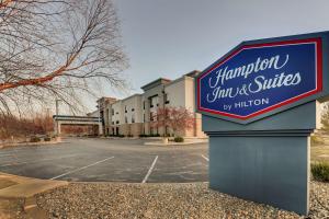 a sign for a hotel in a parking lot at Hampton Inn & Suites St. Louis - Edwardsville in Glen Carbon