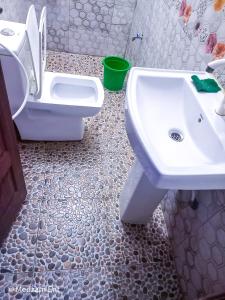 a bathroom with a sink and a toilet at Studio at Mombasa, Kisimani, Apt 607 in Mombasa