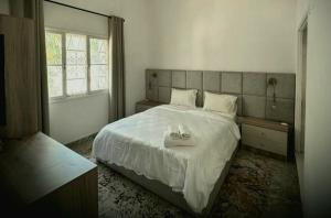 Postel nebo postele na pokoji v ubytování Guesthouse MALAGUETA INN II