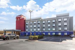 a large building with a parking lot in front of it at Comfort Suites Wilson - I - 95 in Wilson