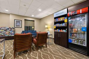 a store with chairs and a drink cooler at Comfort Suites in Nashville