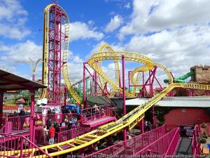 a pink and yellow roller coaster at a amusement park at Victoria House Near Beach With Free Parking in Southend-on-Sea