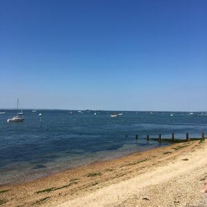 a beach with a boat in the water at Victoria House Near Beach With Free Parking in Southend-on-Sea