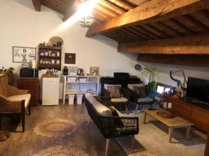 a living room filled with furniture and a piano at Il Castello di Alberico in Cotignola