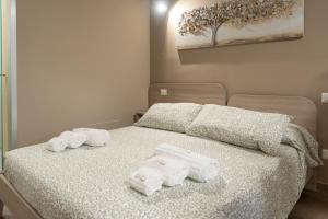 A bed or beds in a room at le stanze di via veneto