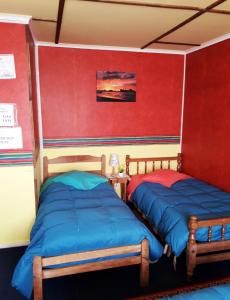 Ліжко або ліжка в номері Hospedaje Independencia y camping