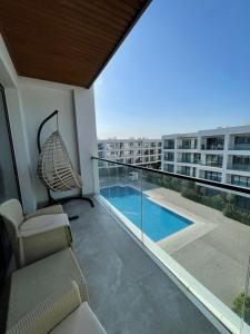 a balcony with a hammock and a view of a building at Sea Breeze Studio in Baku