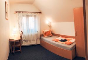 Postel nebo postele na pokoji v ubytování Penzion V Maštali