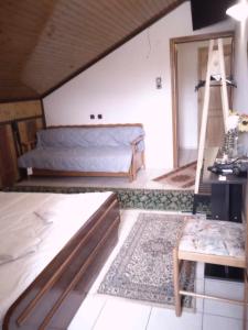 a room with two beds and a table in it at Kostis Hause in Kastrákion