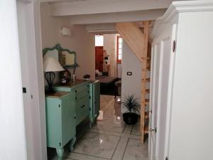 a hallway with a green dresser in a room at Centro Storico MARE FUORI in Brindisi