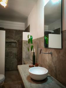 a bathroom with a white sink on a marble counter at Icarai Kite House in Icaraí