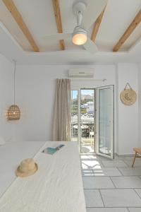 a bedroom with a bed with a hat on it at Sofi pension in Naxos Chora