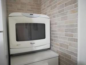 TV a/nebo společenská místnost v ubytování Casa Marina + 29 fotografií