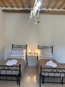 A bed or beds in a room at B&B I Giardini