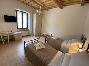 A bed or beds in a room at B&B I Giardini