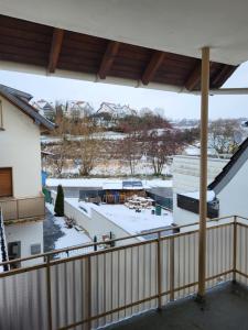 a view from the balcony of a building with snow on the ground at Gemeinschaft Ferienhaus in Bad Neuenahr-Ahrweiler