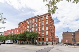 a large red brick building on a city street at Urban Oasis: Work, Play, Unwind in Warehouse Dist in Cleveland