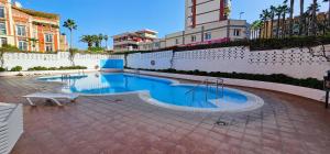 a swimming pool in the middle of a building at Estudio tranquilo cerca del mar. in Puerto de la Cruz