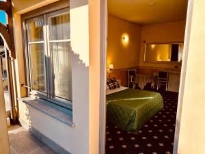 a hotel room with a bed and a window at MOTEL Malpensa INN & Hotel-Airport in Case Nuove