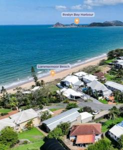 an aerial view of a beach with houses and the ocean at ARay at Cooee Bay - Apt B - Beach House Yeppoon in Yeppoon