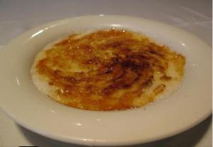 a white bowl of food on a white plate at Alojamiento Oviedo 1 in Oviedo +13 photos