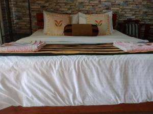 Postel nebo postele na pokoji v ubytování Secret View Homestay Ella