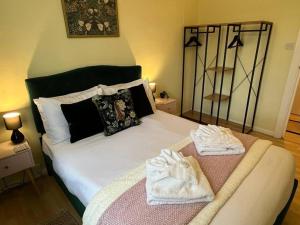 a bedroom with a bed with towels on it at Central Brighton Pavilion Pad. in Brighton & Hove