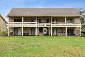 a large house with a lawn in front of it at Seascape Villa - 35D in Destin