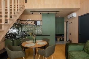 a kitchen and dining room with a table and chairs at Tysha in Tatariv